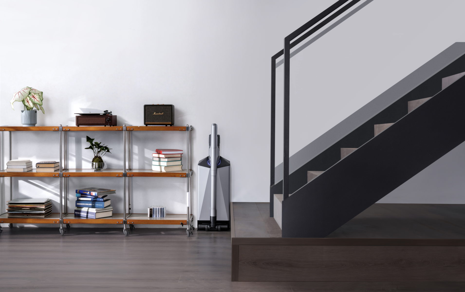 Narwal V50 Cube station beside shelving at the foot of a staircase